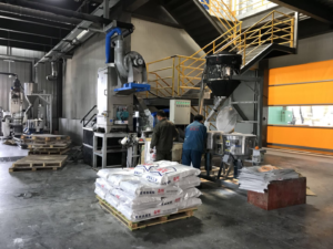 Automated packaging and finished goods area for EVA hot melt adhesive products ready for export