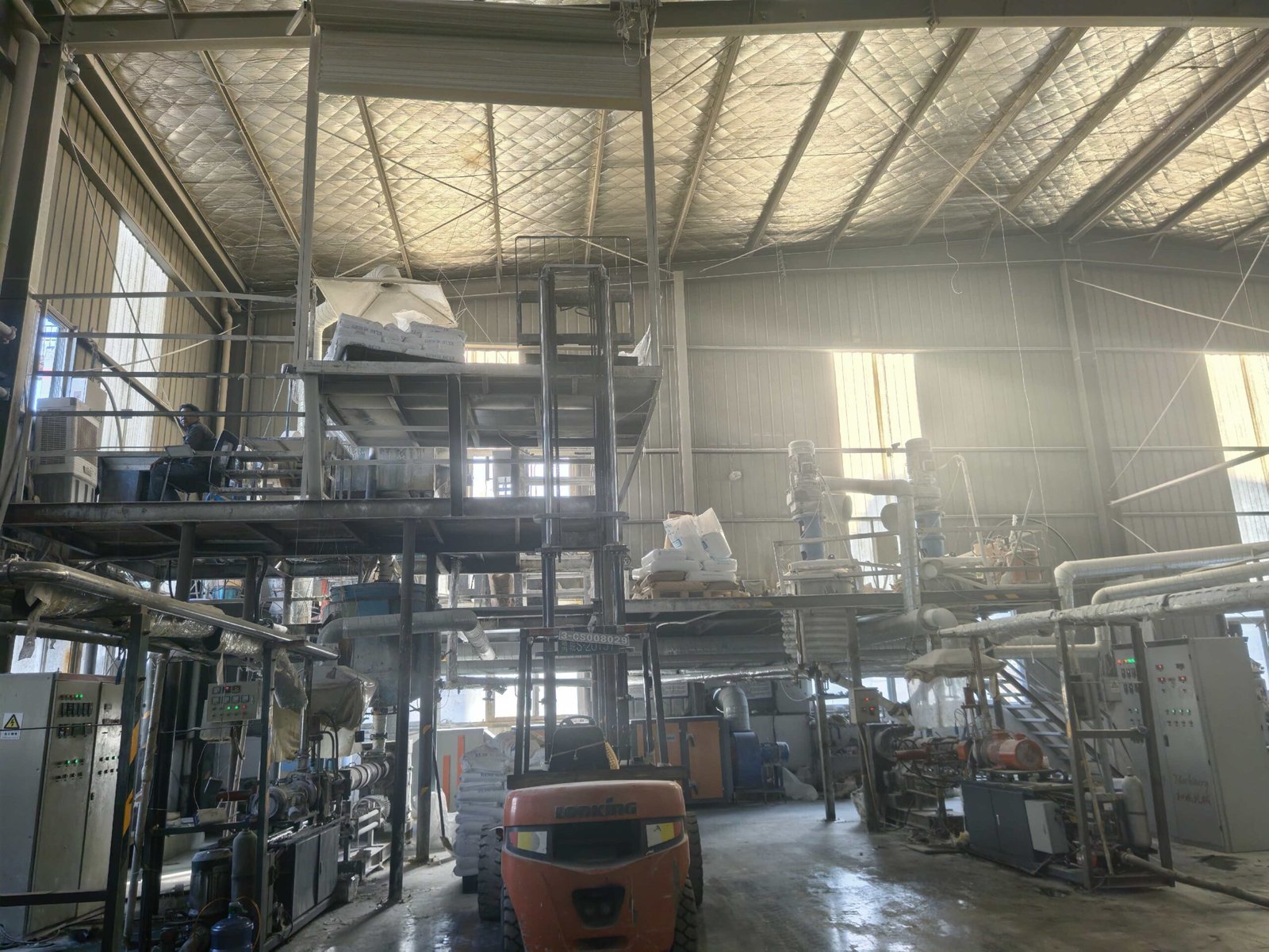 Fully‑automatic hot‑melt adhesive production line in manufacturing workshop