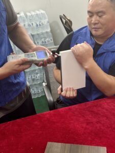 Technician testing hot‑melt adhesive sample for furniture edge banding application