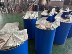 Finished PUR hot melt adhesive packed in blue industrial drums ready for global export