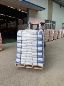 Forklift moving plastic‑wrapped hot melt adhesive pallet