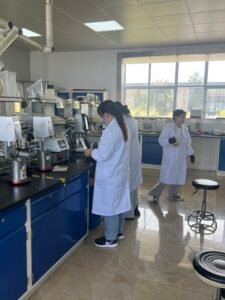 Technicians testing hot melt adhesive in lab