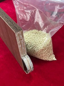 Furniture edge banding sample with hot melt adhesive pellets for glue performance testing